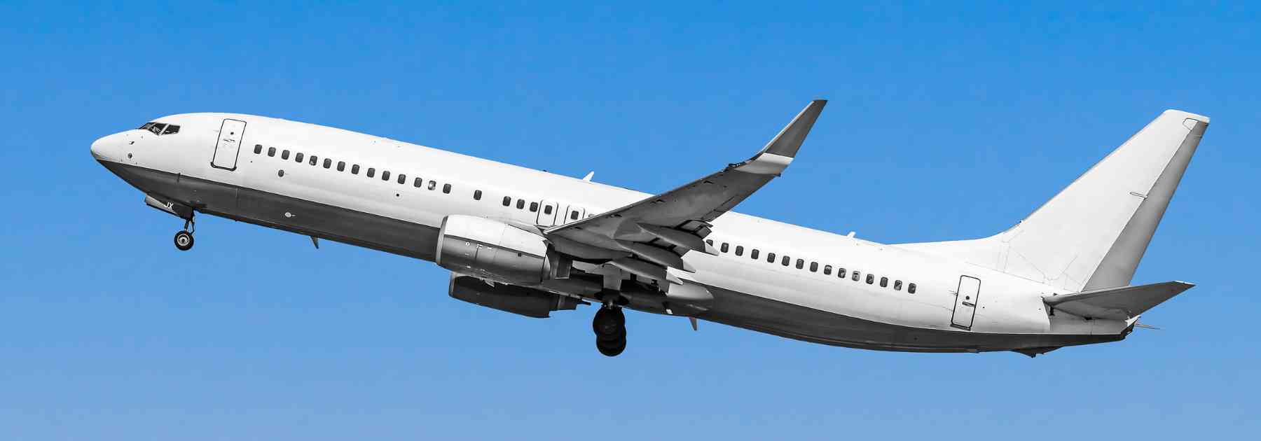 plane flying against blue sky