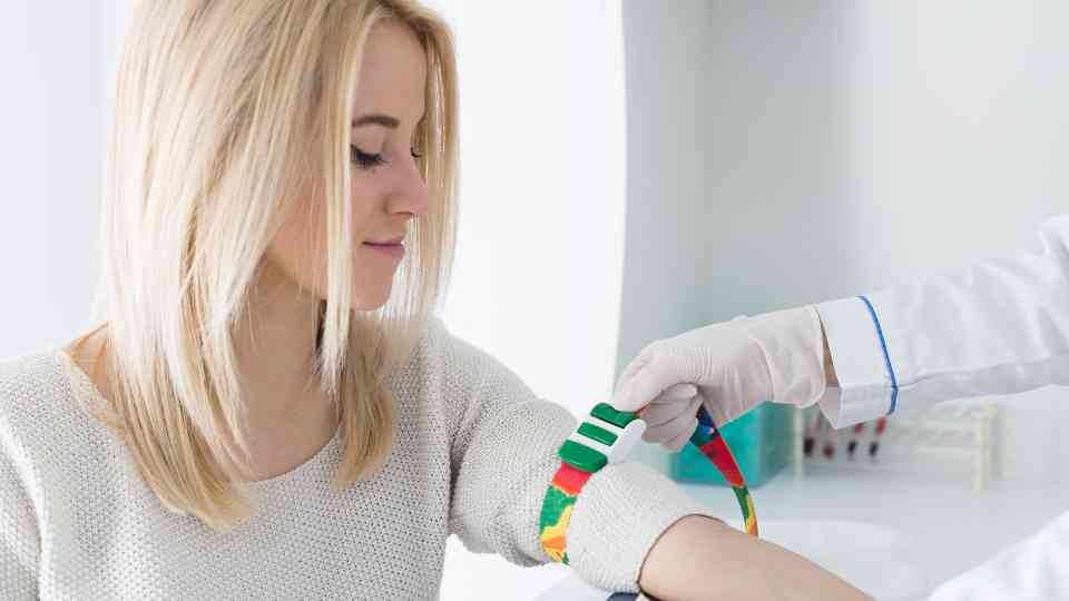 young blonde woman at blood test appointment
