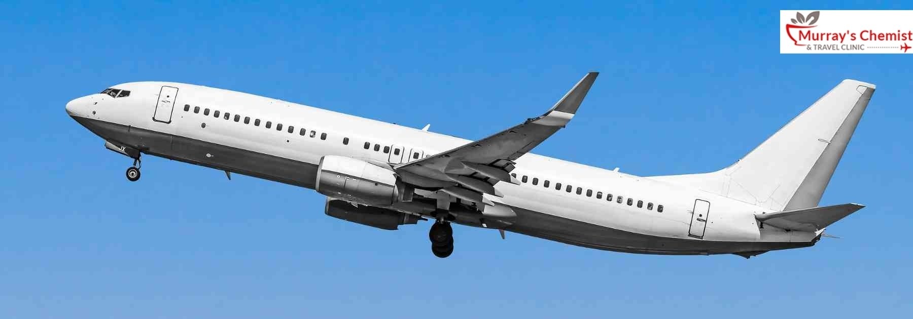 plane flying against blue sky
